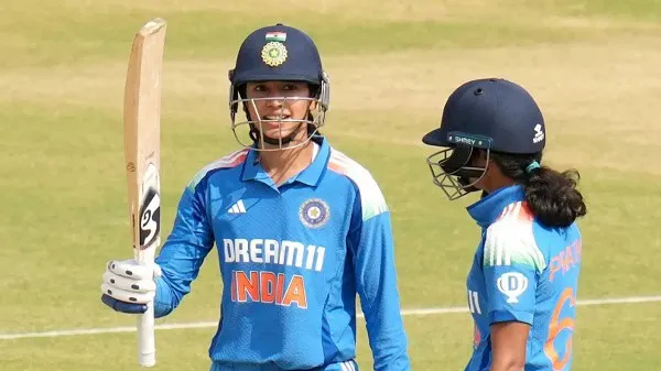 ভারতীয় নারী ক্রিকেটাররা মাঠে, একজন ব্যাট হাতে প্রস্তুত. Channel i News - চ্যানেল আই নিউজ