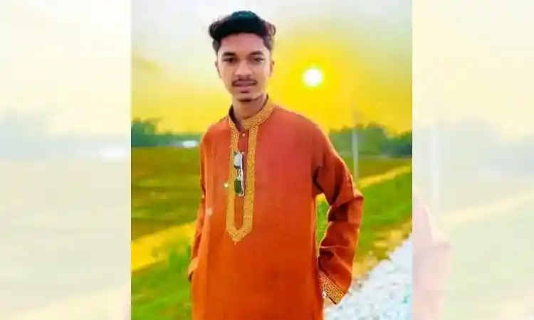 Young man in traditional Bengali attire outdoors at sunset. Channel i News - চ্যানেল আই নিউজ