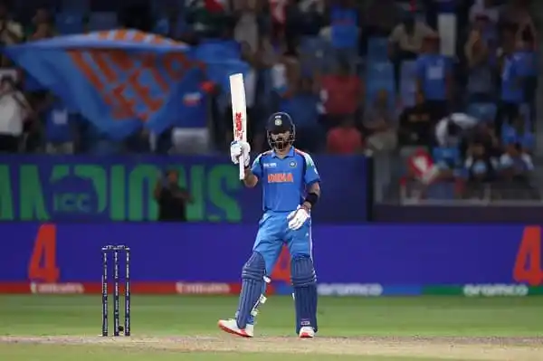 ভারতীয় ক্রিকেটার কোহলি সেঞ্চুরি উদযাপন করছেন. Channel i News - চ্যানেল আই নিউজ