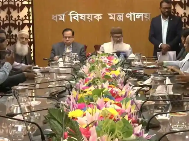 বাংলাদেশের ধর্ম উপদেষ্টাদের বৈঠক, ফুলের সাজে সজ্জিত টেবিলের সামনে।. Channel i News - চ্যানেল আই নিউজ