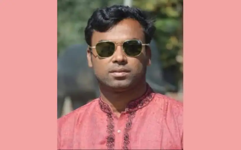 স্বেচ্ছাসেবক লীগ নেতার ছবি, sunglasses পরা, পটভূমিতে সবুজ গাছপালা. Channel i News - চ্যানেল আই নিউজ