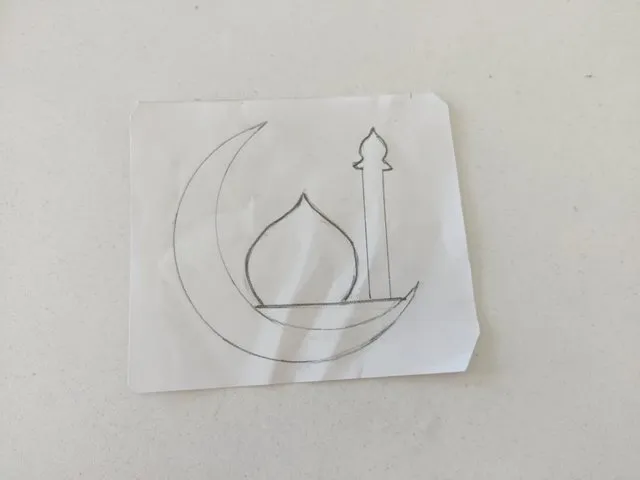 Hand-drawn Islamic crescent moon and minaret on paper. Channel i News - চ্যানেল আই নিউজ