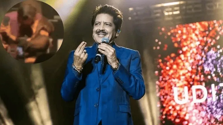 উদিতের ছবি, তিনি মঞ্চে দাঁড়িয়ে হাসছেন ও বক্তৃতা দিচ্ছেন।. Channel i News - চ্যানেল আই নিউজ