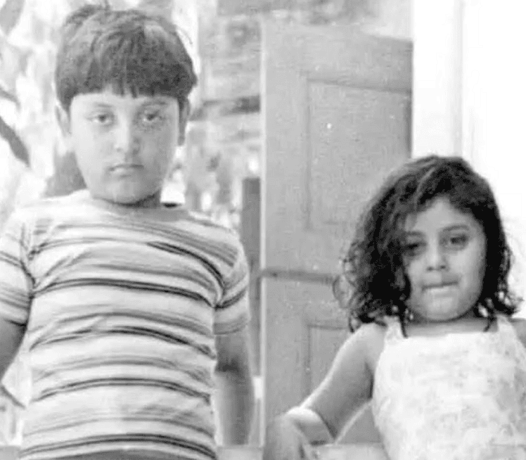 Black and white photo of two children, a boy and a girl, standing outdoors. Channel i News - চ্যানেল আই নিউজ