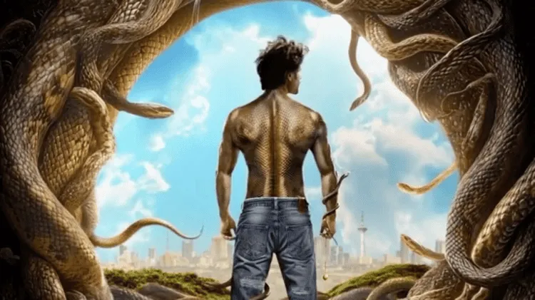 নাগের মতো সাপের গর্তের মধ্য দিয়ে একজন যুবক দাঁড়িয়ে আছেন।. Channel i News - চ্যানেল আই নিউজ