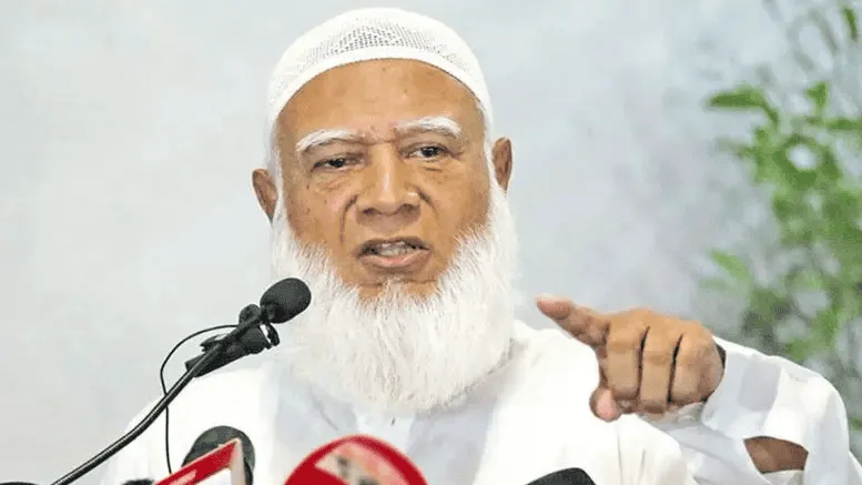 একজন মুসলিম নেতা বক্তৃতা দিচ্ছেন, পেছনে সবুজ গাছের পাতা. Channel i News - চ্যানেল আই নিউজ