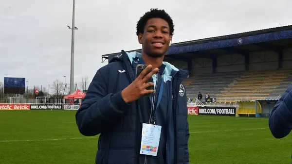 Young football player smiling at the stadium with a peace sign. Channel i News - চ্যানেল আই নিউজ