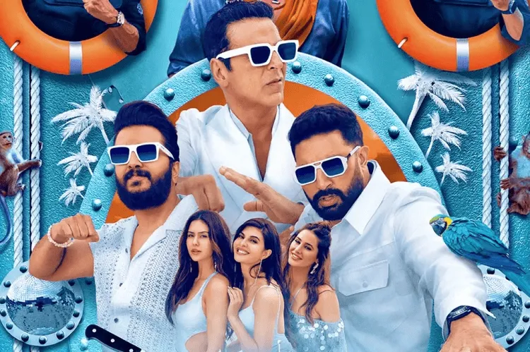 সিনেমার দৃশ্য যেখানে চারজন পুরুষ ও চারজন নারী সমুদ্র সৈকত ও জলপাই রঙের জীবন রক্ষাকারী বল্লা নিয়ে ছবি. Channel i News - চ্যানেল আই নিউজ