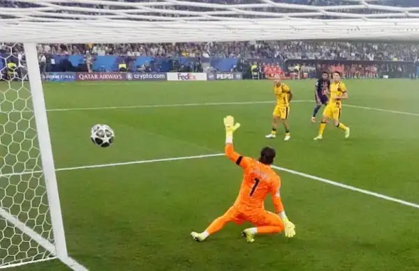 Goalkeeper saves shot during a football match in a packed stadium. Channel i News - চ্যানেল আই নিউজ