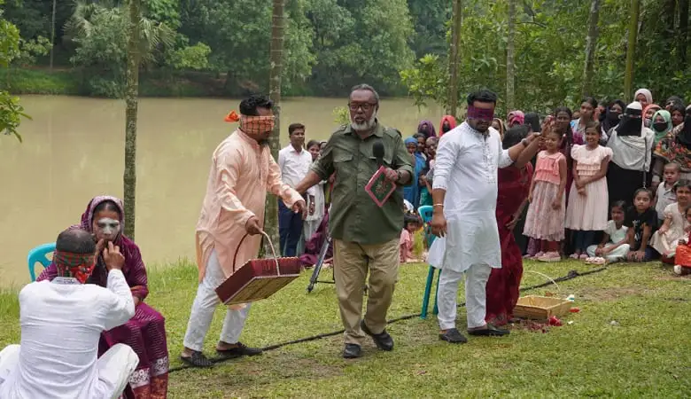 Bangladeshi people enjoying outdoor traditional game by a river. Channel i News - চ্যানেল আই নিউজ