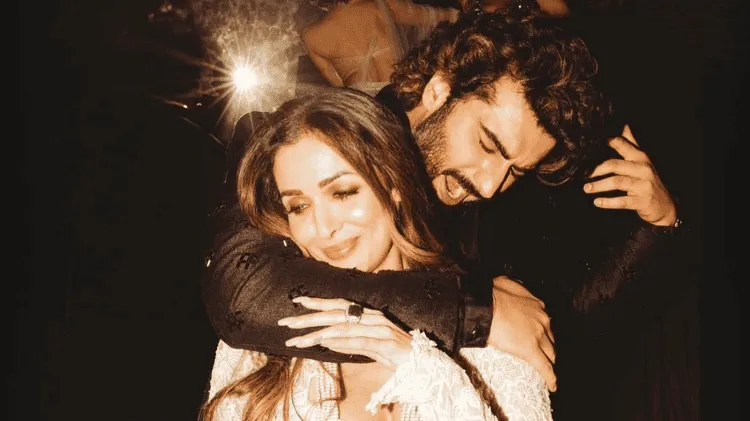 দুজন মানুষ একে অপরকে জড়িয়ে ধরে খুশি হয়েছেন।. Channel i News - চ্যানেল আই নিউজ