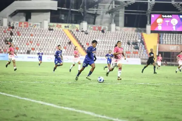 বাংলাদেশ ও ভুটানের ফুটবল ম্যাচে খেলোয়াড়রা মাঠে প্রতিদ্বন্দ্বিতা করছে. Channel i News - চ্যানেল আই নিউজ
