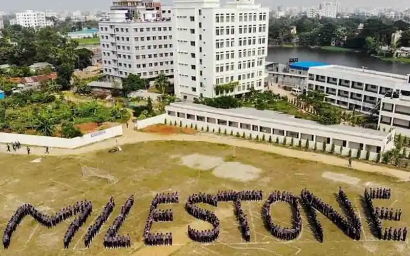 Students form the word 'MILESTONE' on a school field in Bangladesh. Channel i News - চ্যানেল আই নিউজ