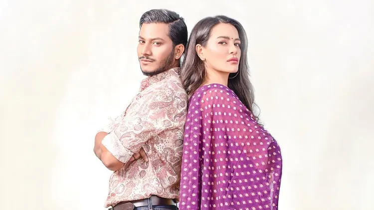 দুটি মানুষ একে অপরের পেছনে দাঁড়িয়ে, পটভূমিতে হালকা রঙের ব্যাকগ্রাউন্ড।. Channel i News - চ্যানেল আই নিউজ