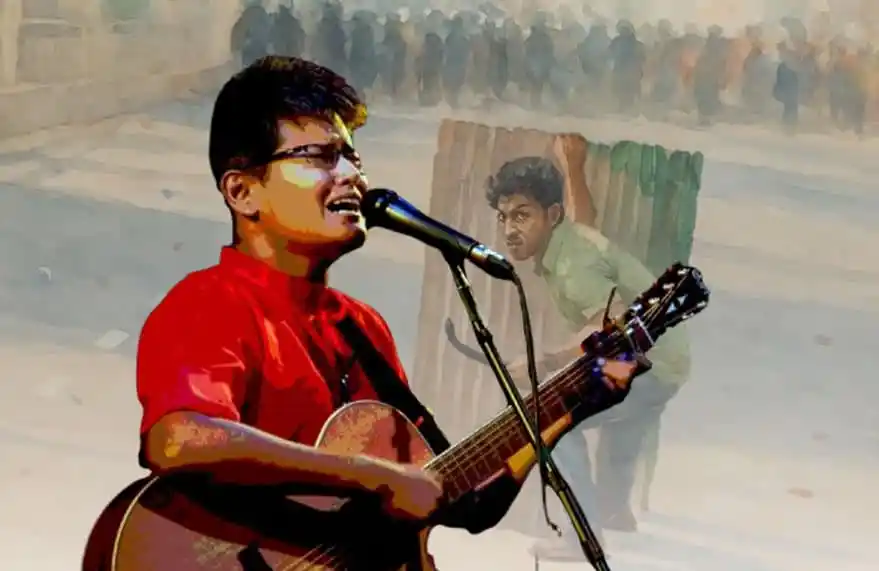 গায়ক সায়ান গিটার বাজিয়ে গান পরিবেশন করছেন, দর্শকরা দূরে দাঁড়িয়ে শুনছেন. Channel i News - চ্যানেল আই নিউজ