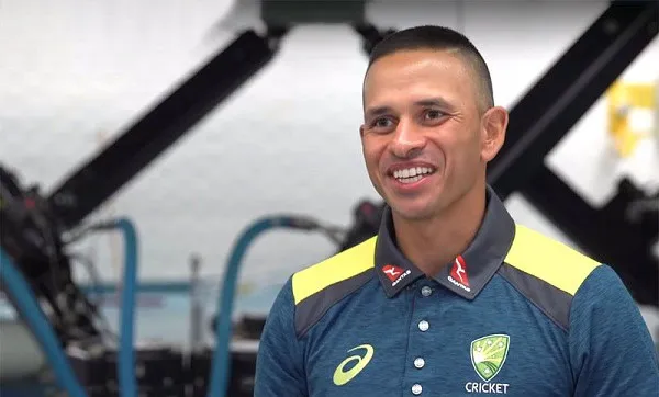 Australian cricketer in team uniform smiling at a press event. Channel i News - চ্যানেল আই নিউজ