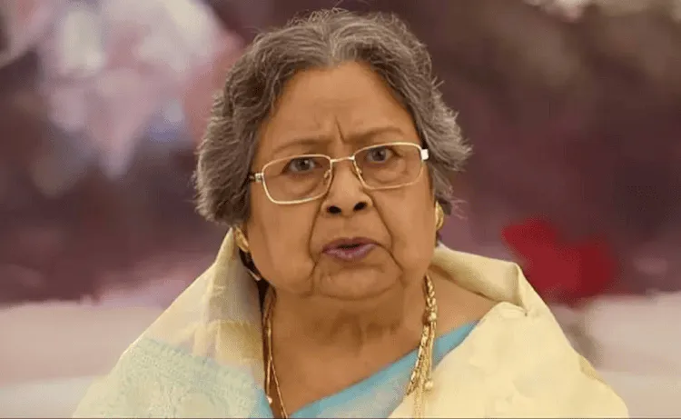 বয়সী নারী, স্পষ্ট অভিব্যক্তি সহ, পাঞ্জাবি ও গহনা পরিহিত. Channel i News - চ্যানেল আই নিউজ