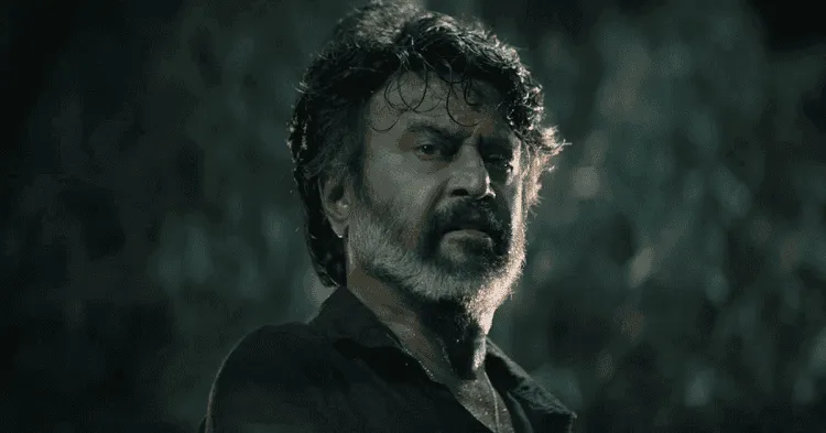 রজনীকান্তের একটি দৃশ্য, তিনি গাঢ় পটভূমিতে দাঁড়িয়ে আছেন।. Channel i News - চ্যানেল আই নিউজ