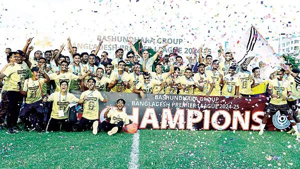 Bangladesh football team celebrating championship victory with confetti and trophy. Channel i News - চ্যানেল আই নিউজ