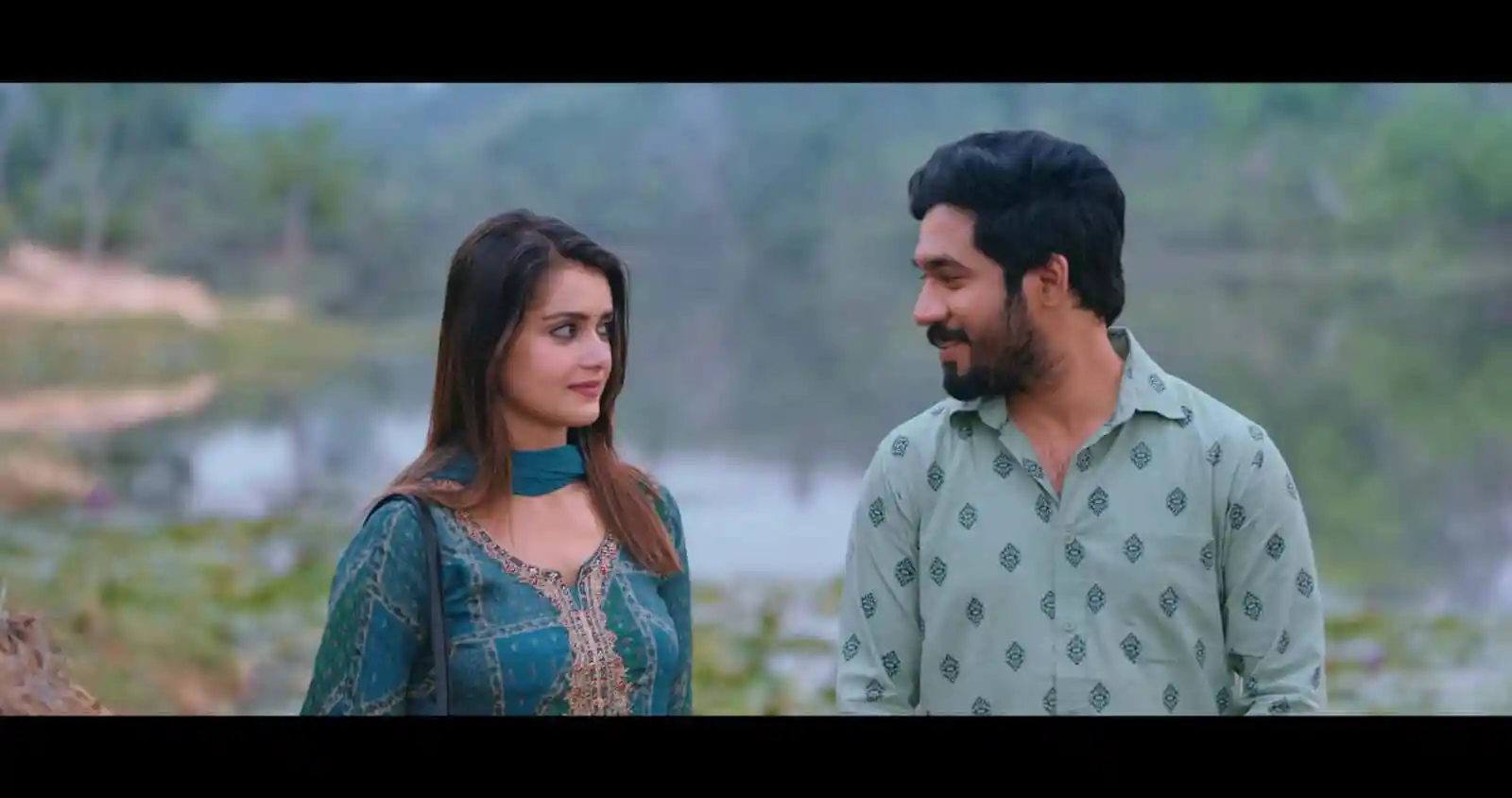 দুজন মানুষ নদীর পাশে কথা বলছে, প্রকৃতি পরিবেশে সুন্দর দৃশ্য।. Channel i News - চ্যানেল আই নিউজ