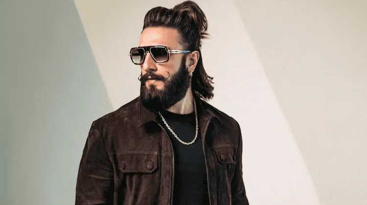 Stylish man with sunglasses and beard in a modern setting. Channel i News - চ্যানেল আই নিউজ