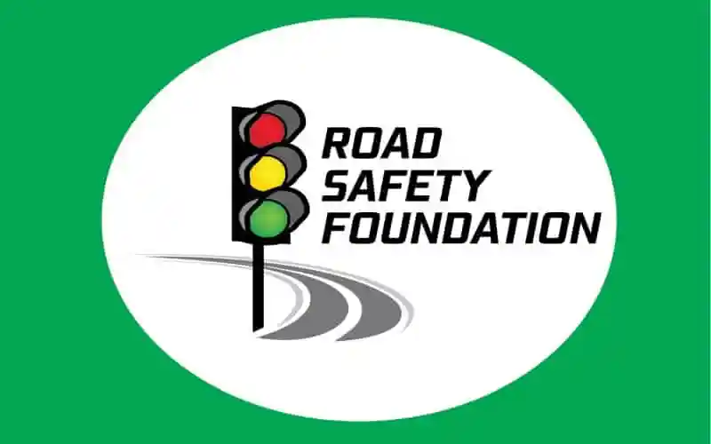 Road Safety Foundation logo with traffic light and road illustration. Channel i News - চ্যানেল আই নিউজ