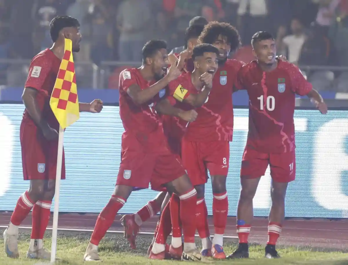 বাংলাদেশ ফুটবল দল গোল উদযাপন করছে, মাঠে খেলা চলমান. Channel i News - চ্যানেল আই নিউজ
