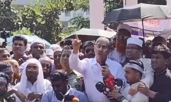 Politician addressing a crowd with microphones and media coverage in Bangladesh. Channel i News - চ্যানেল আই নিউজ