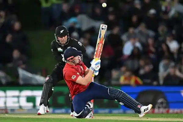 Cricket player sliding while another player attempts to catch the ball. Channel i News - চ্যানেল আই নিউজ