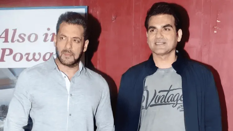 দুই পুরুষ একসঙ্গে দাঁড়িয়ে, একটি অনুষ্ঠানে অংশগ্রহণ করছেন।. Channel i News - চ্যানেল আই নিউজ