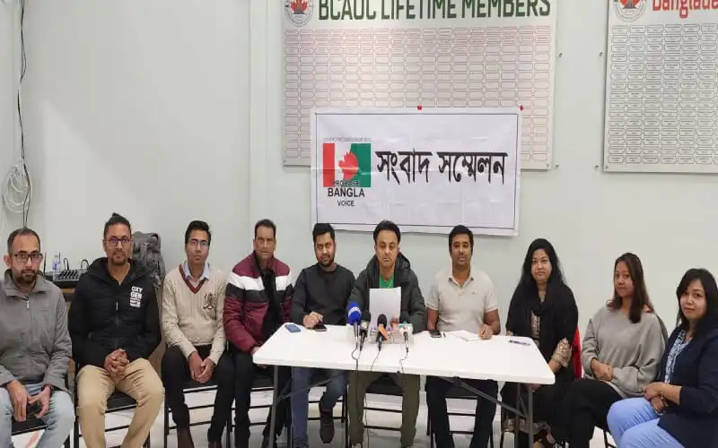 সংবাদ সম্মেলনে অংশগ্রহণকারী ব্যক্তিরা বসে আছেন, পেছনে বোর্ডে লেখা রয়েছে. Channel i News - চ্যানেল আই নিউজ