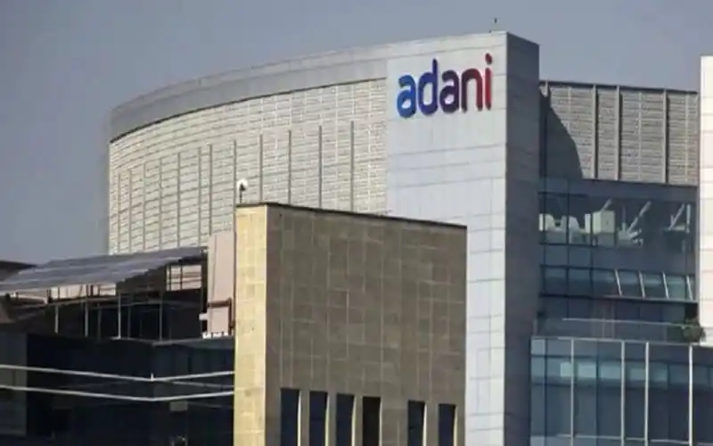 Adani Group building in Singapore with modern architecture. Channel i News - চ্যানেল আই নিউজ