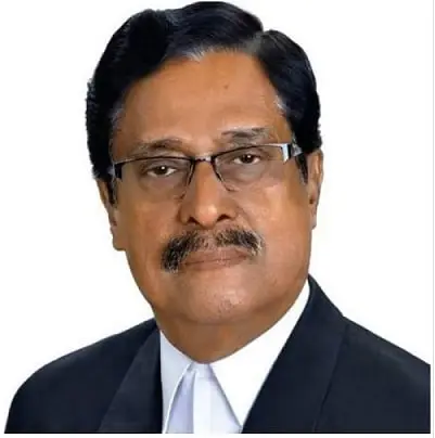 প্রভাবশালী রাজনীতিবিদের পোর্ট্রেট, চোখে চশমা, কালো স্যুটে. Channel i News - চ্যানেল আই নিউজ