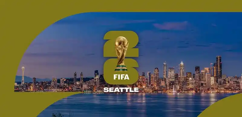 FIFA World Cup trophy with Seattle skyline at dusk. Channel i News - চ্যানেল আই নিউজ