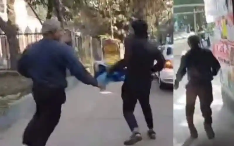 Two men involved in a physical altercation on a street in Bangladesh. Channel i News - চ্যানেল আই নিউজ