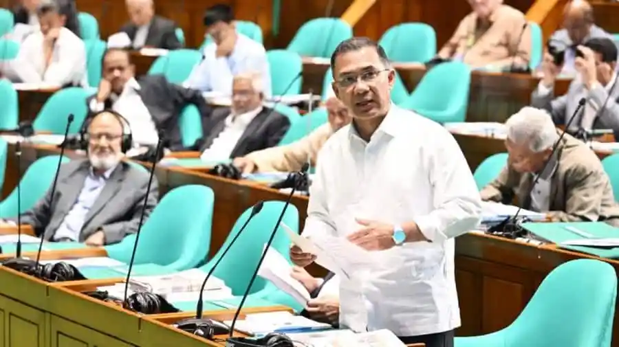 প্রধানমন্ত্রী সংসদে বক্তব্য দিচ্ছেন, অন্যান্য সদস্যরা শুনছেন।. Channel i News - চ্যানেল আই নিউজ