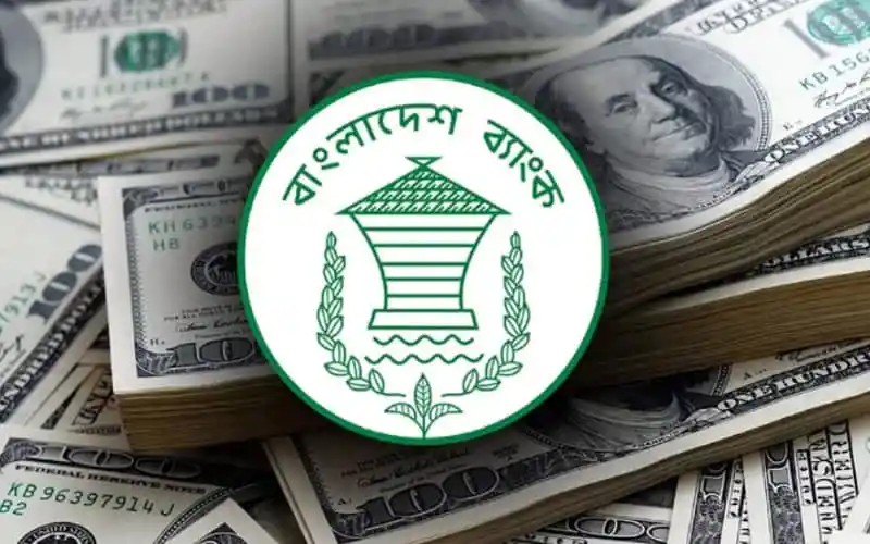 বাংলাদেশের কেন্দ্রীয় ব্যাংকের লোগো সহ ডলার ব্যাংকনোটের ছবি. Channel i News - চ্যানেল আই নিউজ