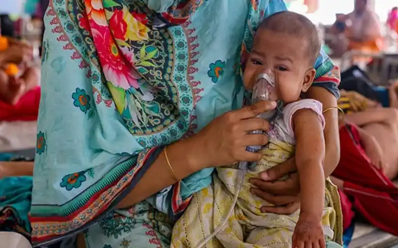 Child receiving oxygen therapy at a healthcare facility in Bangladesh. Channel i News - চ্যানেল আই নিউজ