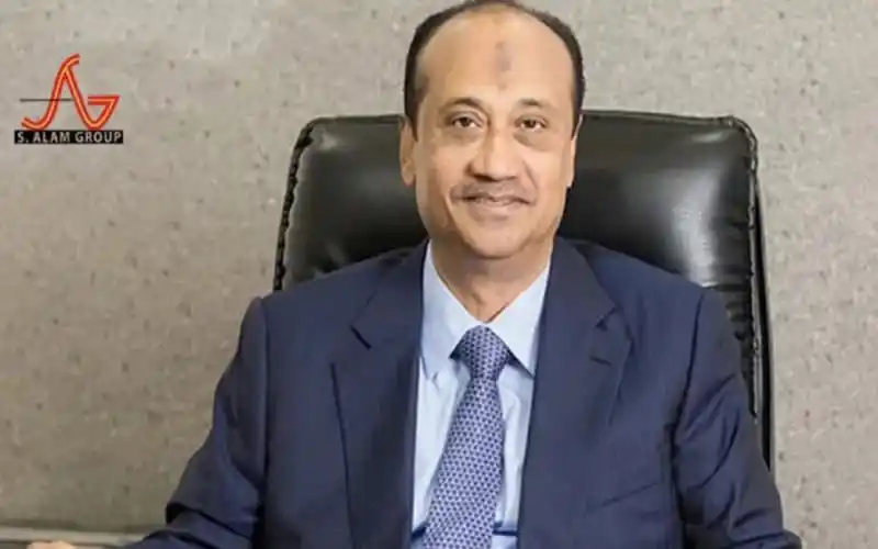 S Alam Group executive in formal suit sitting in office chair. Channel i News - চ্যানেল আই নিউজ