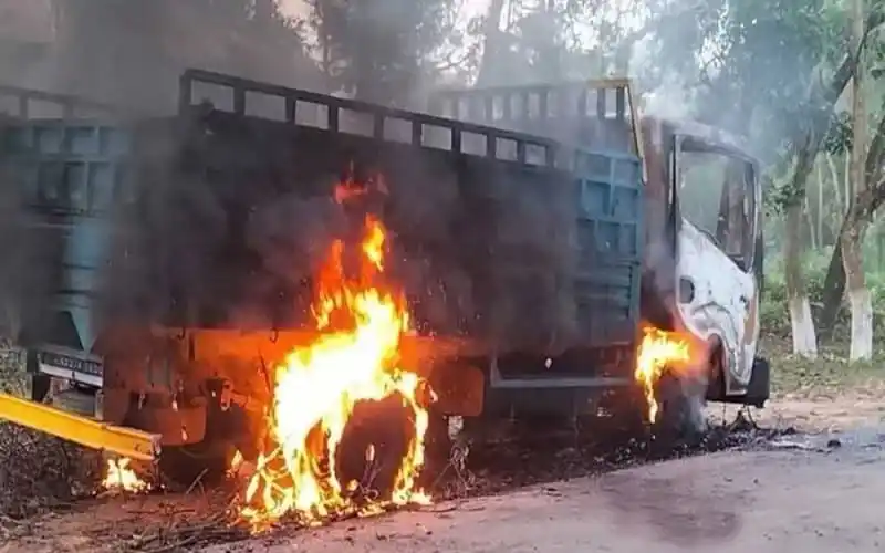 Burning truck on the roadside during a protest or incident. Channel i News - চ্যানেল আই নিউজ