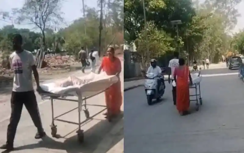 বাবা-মা ছেলেকে স্ট্রেচারে হাসপাতালে নিয়ে যাচ্ছেন, কর্মী-অ্যাম্বুলেন্স নেই।. Channel i News - চ্যানেল আই নিউজ