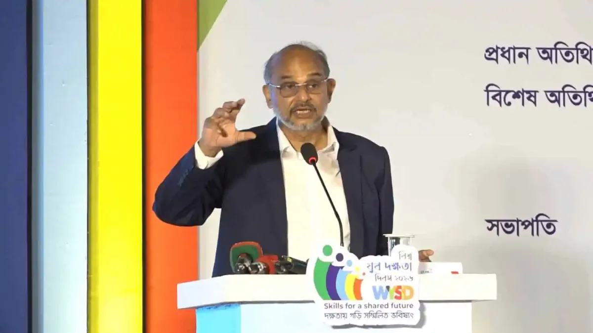 Bangladeshi man speaking at a conference on youth unemployment and skills development. Channel i News - চ্যানেল আই নিউজ