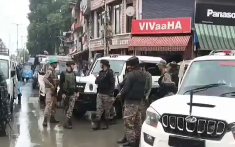 Bangladesh police officers in uniform on duty in a busy street. Channel i News - চ্যানেল আই নিউজ
