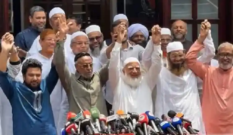 Bangladeshi political leaders and activists celebrate together at a press conference. Channel i News - চ্যানেল আই নিউজ