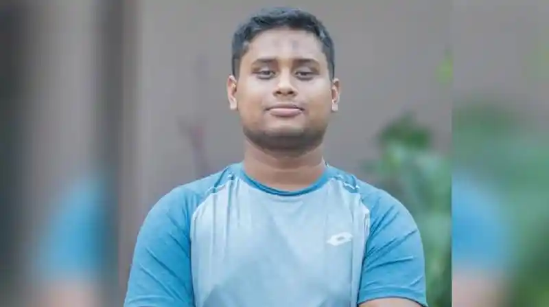 Young man in blue T-shirt with crossed arms outdoors. Channel i News - চ্যানেল আই নিউজ