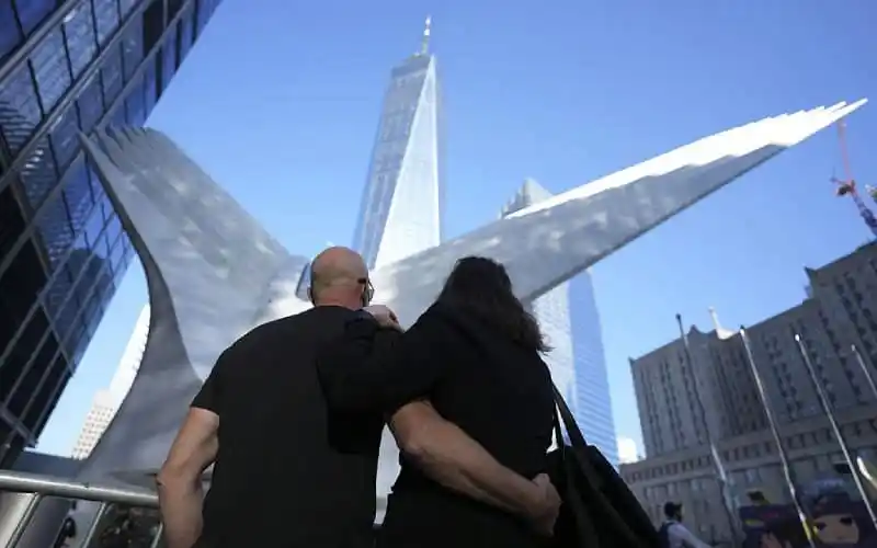 Two tourists admire the One World Trade Center in New York City. Channel i News - চ্যানেল আই নিউজ