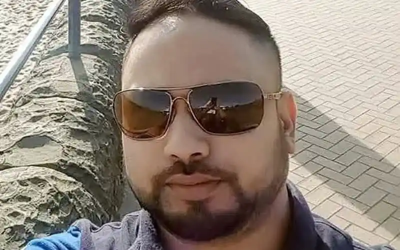 Man wearing sunglasses outdoors in bright sunlight. Channel i News - চ্যানেল আই নিউজ