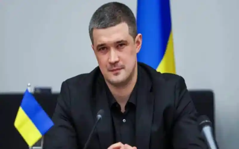 Ukrainian official Fedorov at a press conference with Ukrainian flags behind him. Channel i News - চ্যানেল আই নিউজ