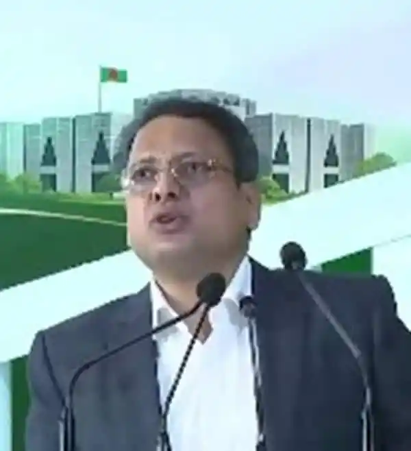 এনবিআর চেয়ারম্যান ভাষণ দিচ্ছেন, পেছনে সংসদ ভবনের দৃশ্য।. Channel i News - চ্যানেল আই নিউজ