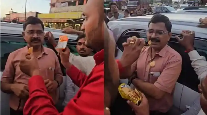 অফিসারকে মেয়াদোত্তীর্ণ বিস্কুট খাওয়ানোর চেষ্টা করছে একজন ব্যক্তি. Channel i News - চ্যানেল আই নিউজ